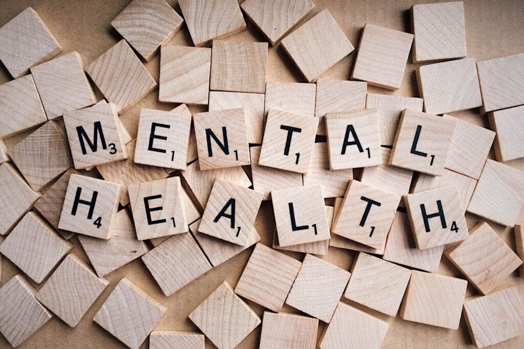 Mental health spelled with Scrabble tiles
